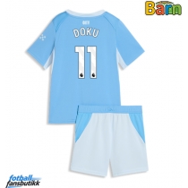 Manchester City Jeremy Doku #11 Hjemmedraktsett Barn 2026-27 Kortermet (+ Korte bukser)